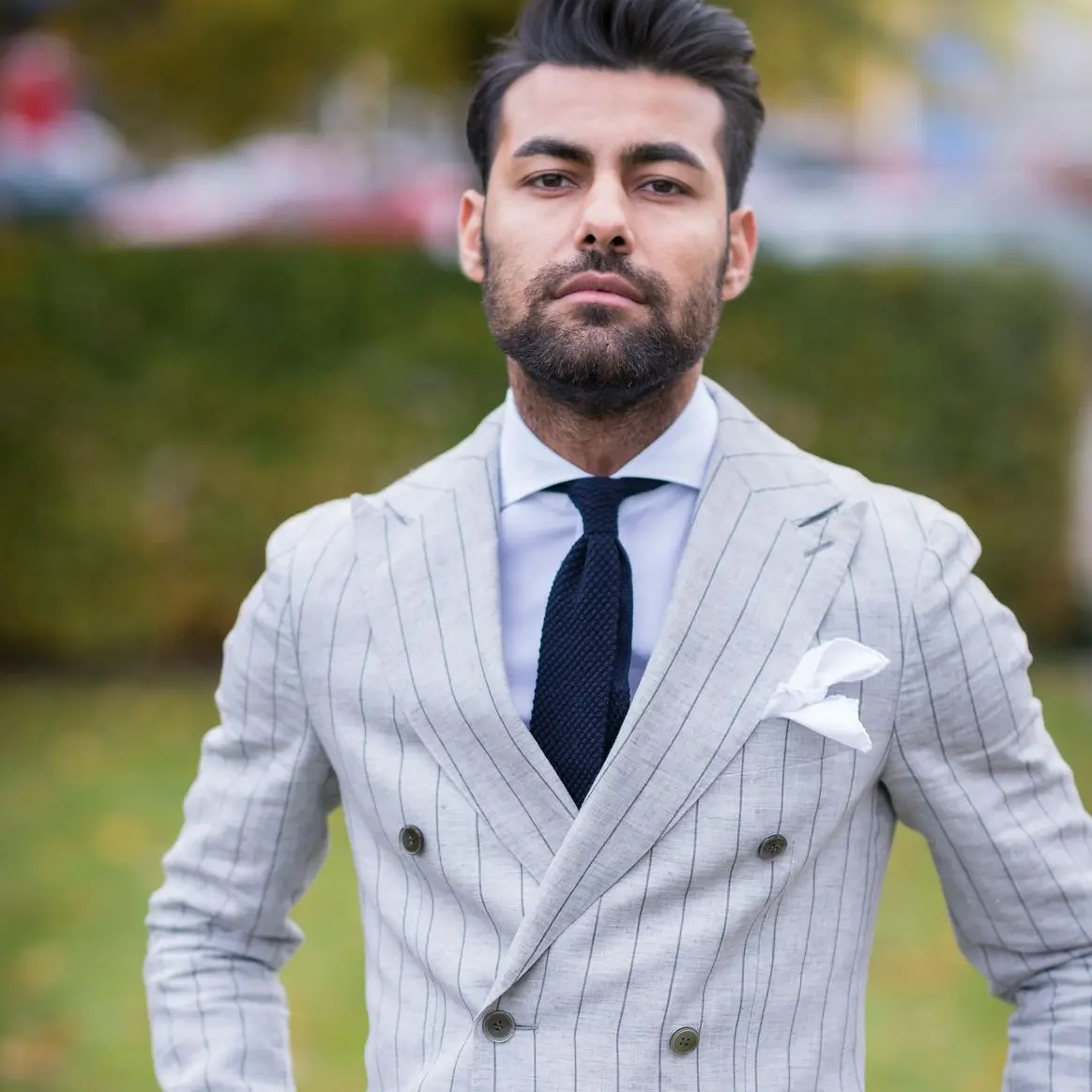 man in white and black pinstripe suit jacket